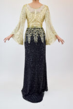 Vestido bicolor negro con dorado, lentejuela y mangas amponas - Image 2